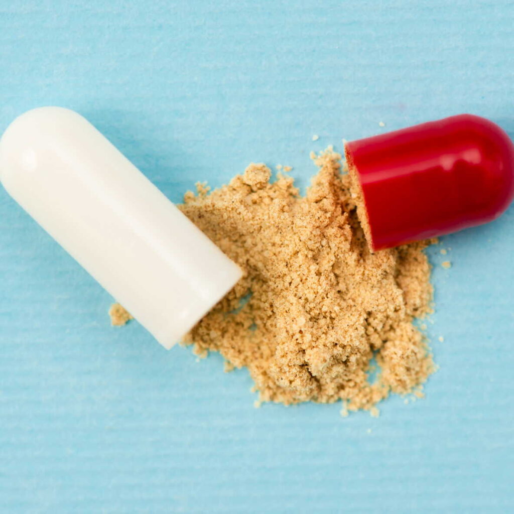 top-view-pill-capsule-blue-background